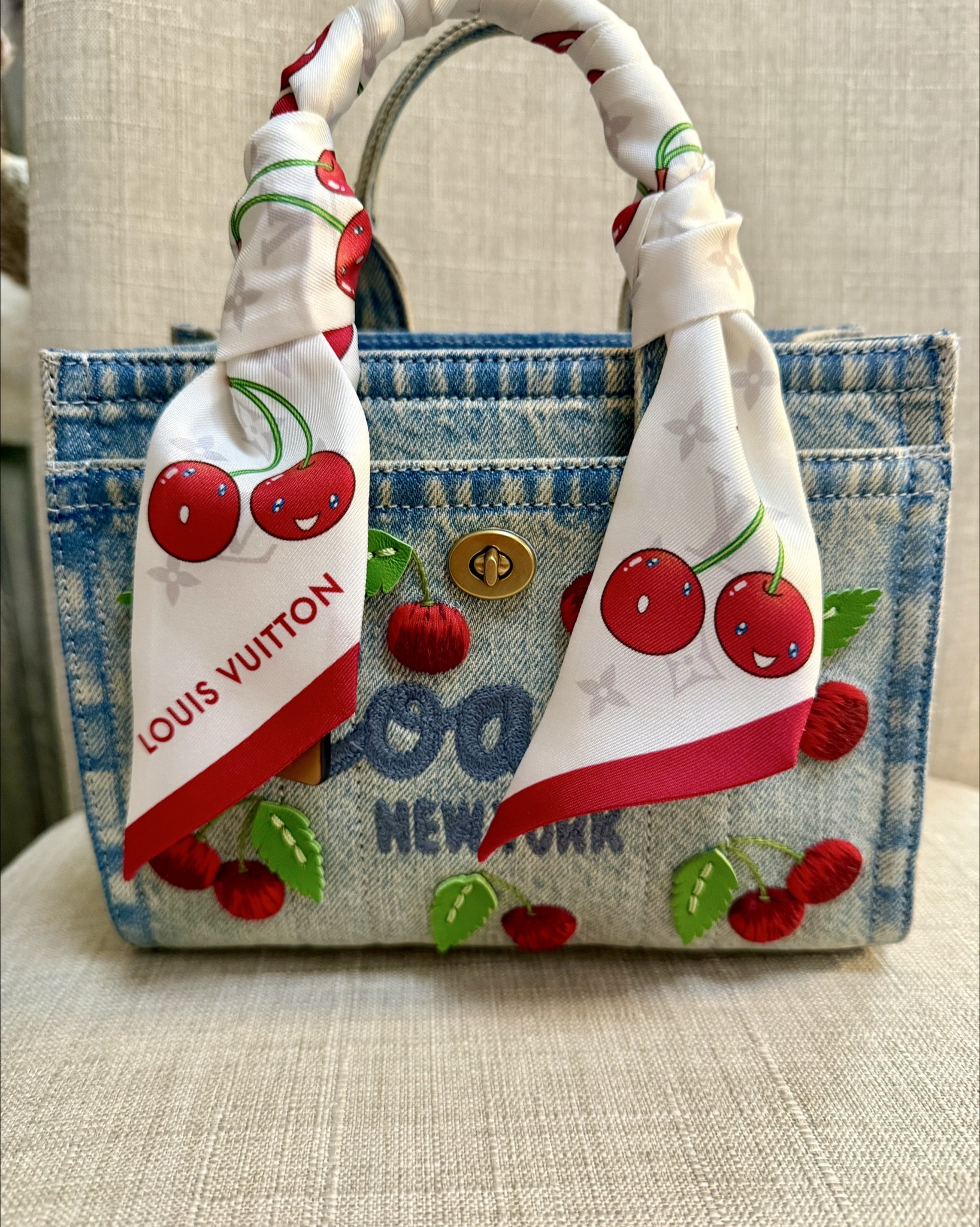 I love the Coach cargo totes because they have a lot of room for items on the inside and then they have a front and back pocket that allows you to keep your phone within reach or other items that are important. This new loved denim with the cherry is so cute. I highly recommend it. ￼

#LTKmomlife #LTKdayinmylife