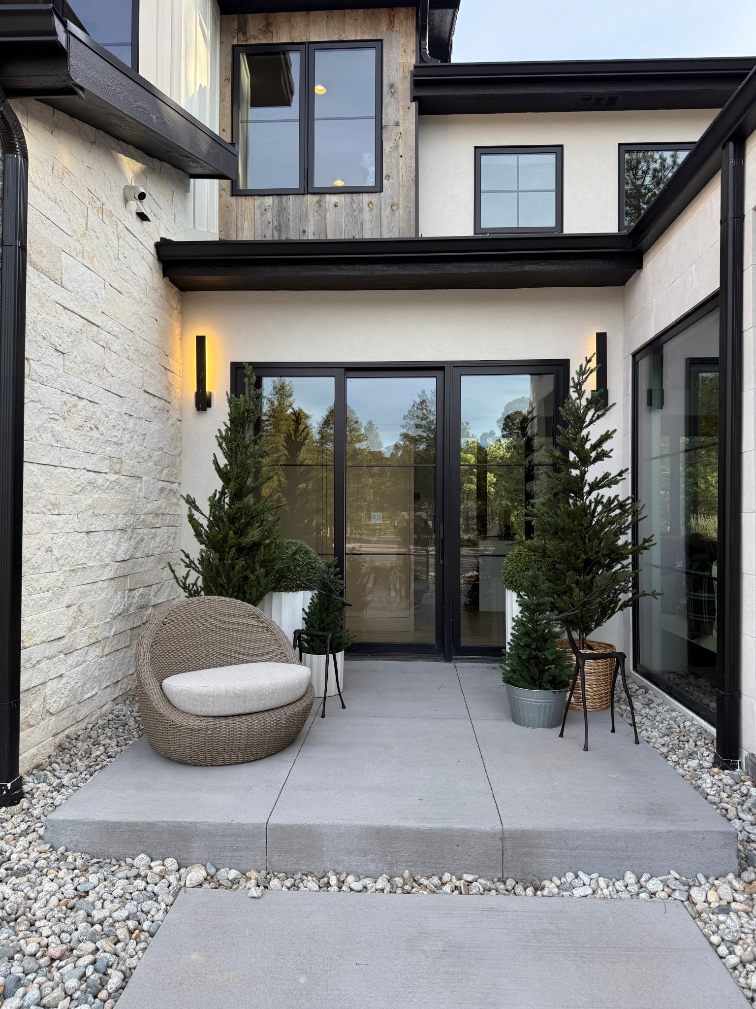 Kept the side porch simple with a few cute potted pine trees and some bronze reindeer. 

#LTKHome #LTKSeasonal