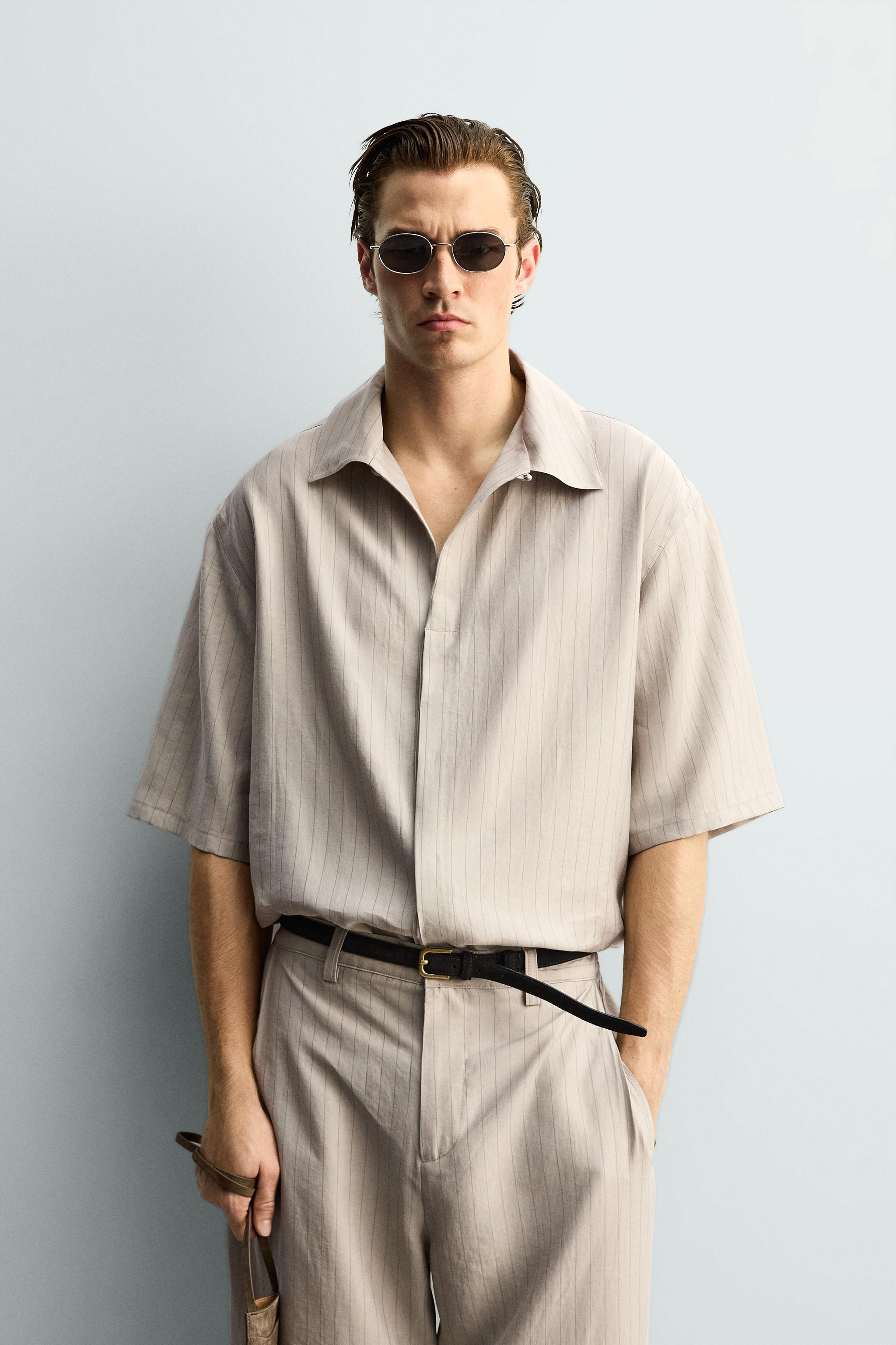 Relaxed fit shirt crafted in a flowy lyocell blend fabric. Features a spread collar, short sleeve... | Zara US
