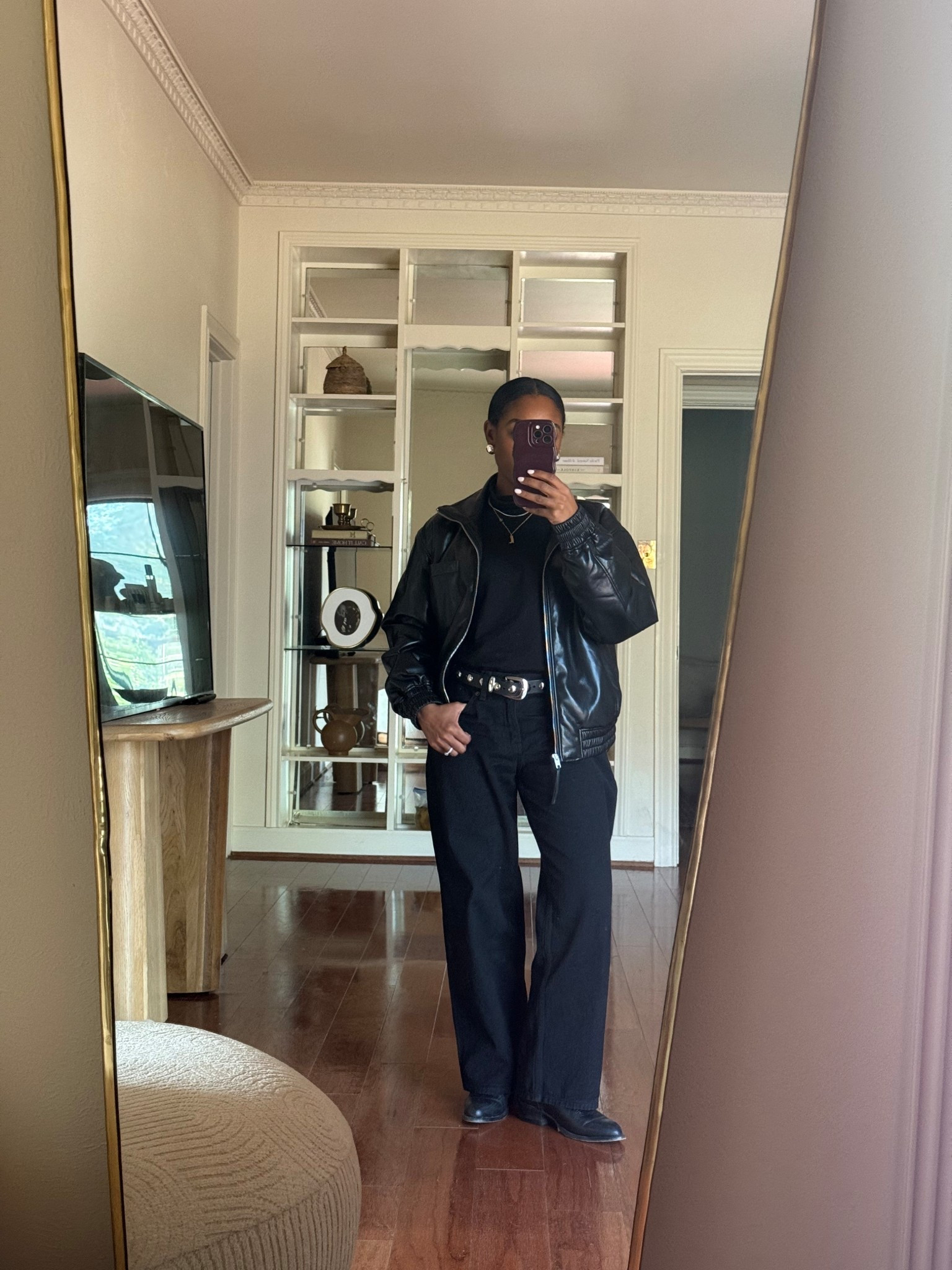 Black faux leather jacket, black jeans, black turtleneck, black cowboy boots 

#LTKmomlife #LTKootd