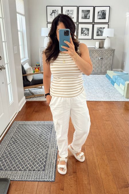 Today’s casual spring outfit! These Gap white cargo pants are seriously so comfortable. The waistband is stretchy, and they’re perfectly loose without being baggy. The striped tank top is also from Gap and such a great basic! It’s so soft and stretchy, and it comes in a bunch of other colors. Linking both because they’re both 40% off today since Gap is having their Friends and Family sale. Also linking my comfy Steve Madden casual sandals and simple gold jewelry from Gorjana. I’ve been wearing Gorjana jewelry for 4 years and can say for certain you can’t beat the quality for the price point! If you have any questions about this look, drop them in the comments! 

#LTKSaleAlert #LTKSeasonal #LTKFindsUnder50