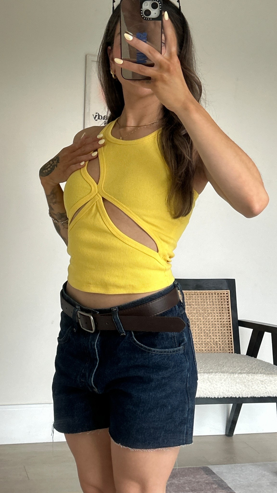 The perfect spring outfit, wearing this asymmetrical, cotton, ribbed, yellow tank top with dark blue washed jean boyfriend shorts!

#LTKpetite #LTKjeans #LTKsummer