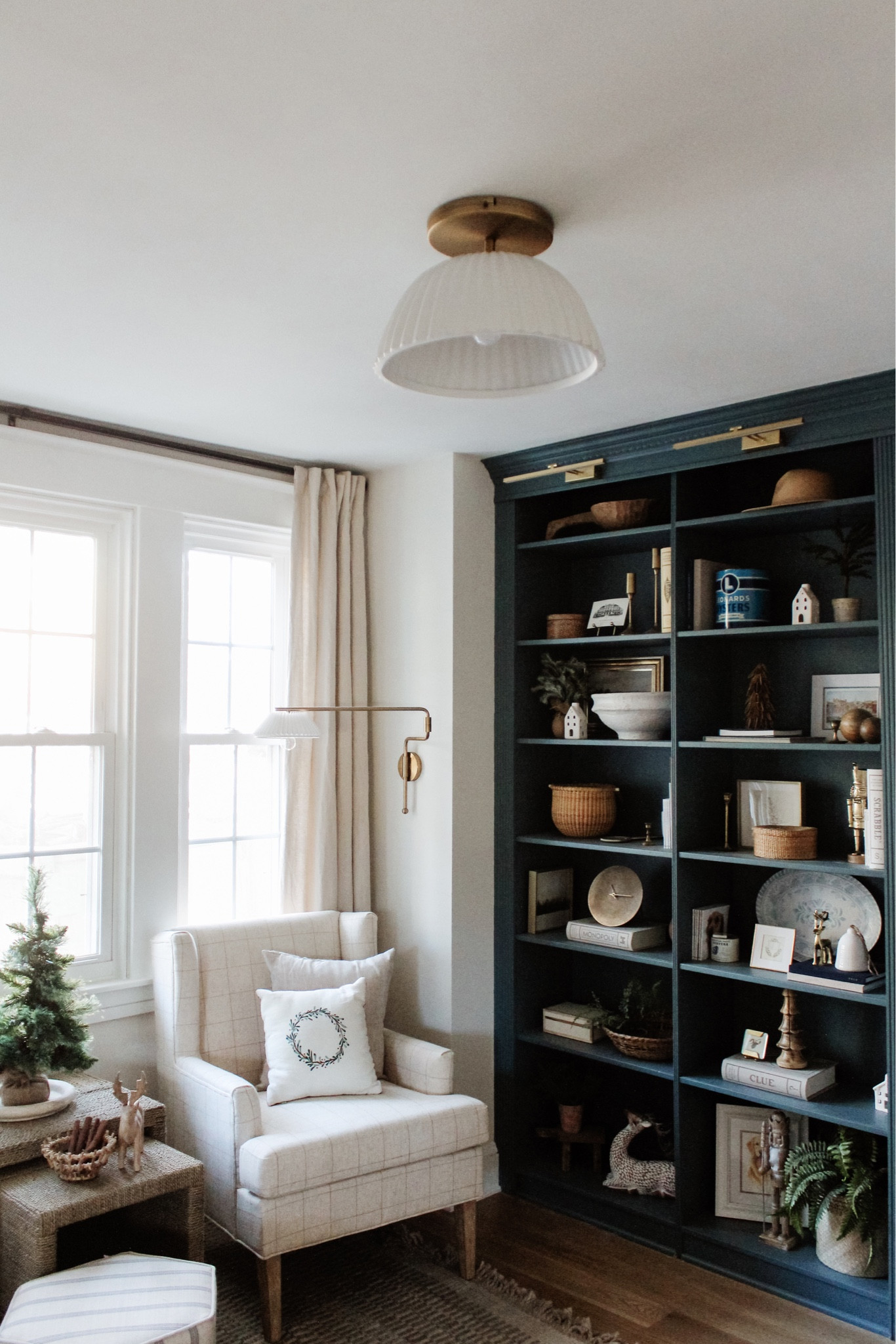 I teased something new in this space and it’s finally here ✨ Sharing this light and a few other items I’m loving at the moment over on megleonard.co - check out via stories, too!
•
Shop my holiday home and more at the link in bio.
•
•
•

Pleated wall sconce, pleated light, sitting room Gold battery operated picture lights, simple home decor, amazon home decor, simple home style Wood bowl, shelf decor, shelf design, shelf styling, decor accents, decorative objects, decorative box, lidded bin, woven basket, faux plant, paper mache bowl, target finds, home style, blue shelves   #shelfdecor #openshelves #whiteandwood #homedecor #flashesofdelight #smpliving #neutraldecor #makehomematter #makehomeyours #hygge #hyggehome #currenthomeview #bhghome #simplehomestyle #cozyhome #countrystylemag #howihaven #pocketofmyhome #interiorismo #apartmenttherapy #shelfiedecor #shelfstyle #shelfstyling #bookcasestyling #shelfiesunday #bluepaint #shelfstylingideas #shelfinspo, Christmas decor, target holiday decor, holiday shelf decor, holiday shelf styling, candle sticks, bottle brush trees, sitting room decor, flush mount light 

#LTKhome #LTKSeasonal #LTKHoliday