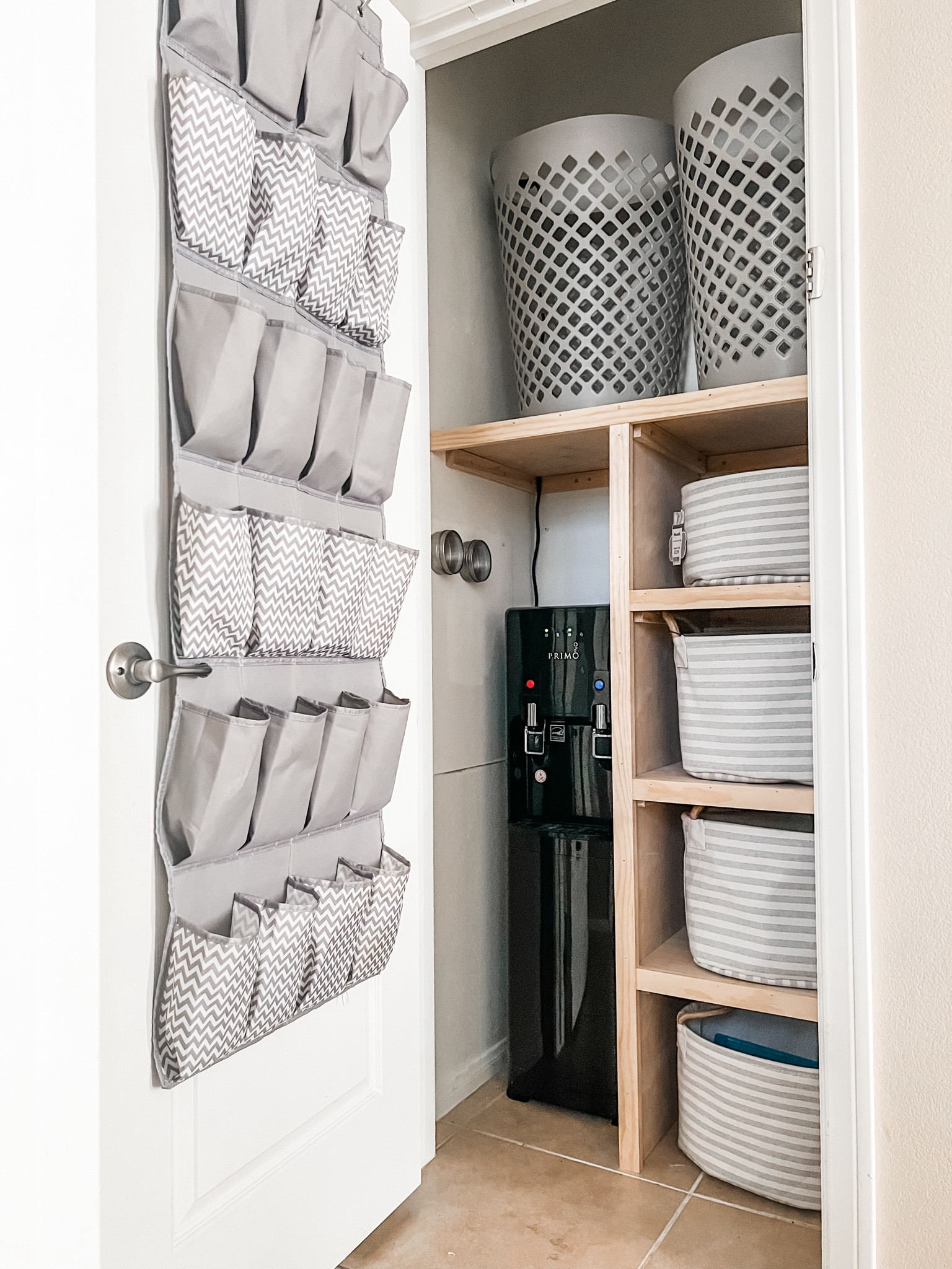 Our 1st project of the new year!  A hallway coat closet repurposed into a laundry sorting system!👏🏻👏🏻👏🏻👏🏻
It turned out to be the perfect spot to put our water machine also!  Now kids can fill up their water bottles on their way out the door!  
#life-simplified #laundryhack #laundrysorting #homeorganization #laundryroom

#LTKfamily #LTKhome