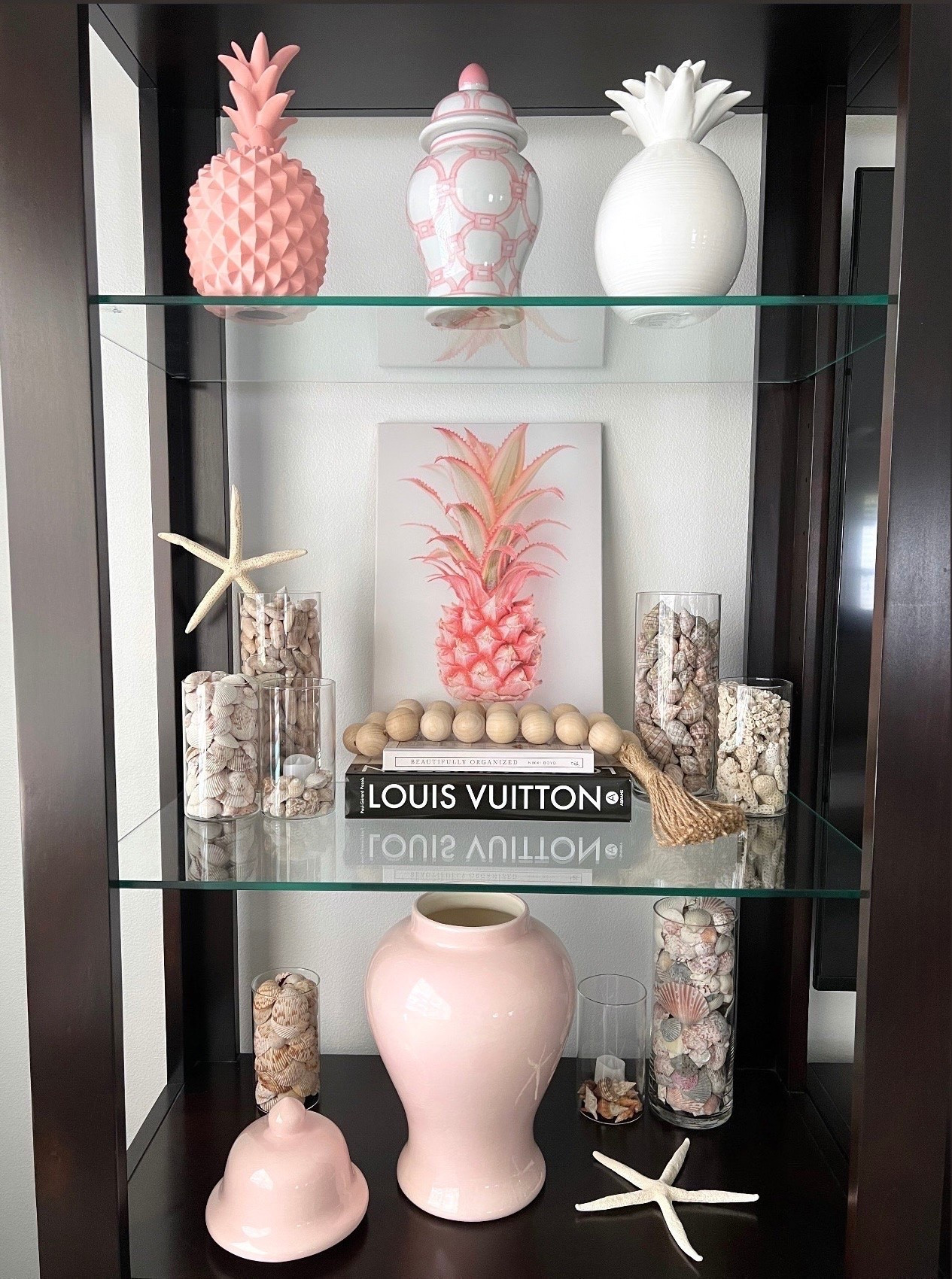 🐚COASTAL DECOR: I wanted to show the other side of my entertainment center. 

I love these cylinder vases from Amazon. They nicely display all of the seashells I found at the beach.

Also linking shell decor for all rooms in your home!

#LTKSeasonal #LTKOver40 #LTKSaleAlert #LTKHome #LTKU