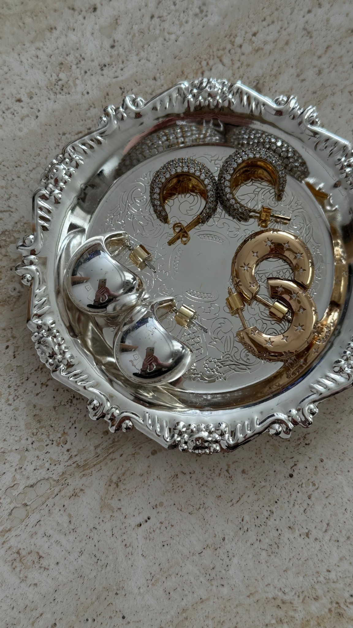 Starry, shiny, and stealing the spotlight ✨ silver dome, pave diamond dome and gold hoops bringing all the sparkle 💫
.
silver dome earrings | pave diamond dome earrings | gold chunky hoops | diamanté star earrings | statement earrings | bold earrings | festive jewellery | party season jewellery | gift guide jewellery | everyday jewellery | jewellery edit | layered earrings | playful jewellery | elevated basics | jewellery flatlay 

#LTKluxury #LTKdatenight #LTKgiftguide