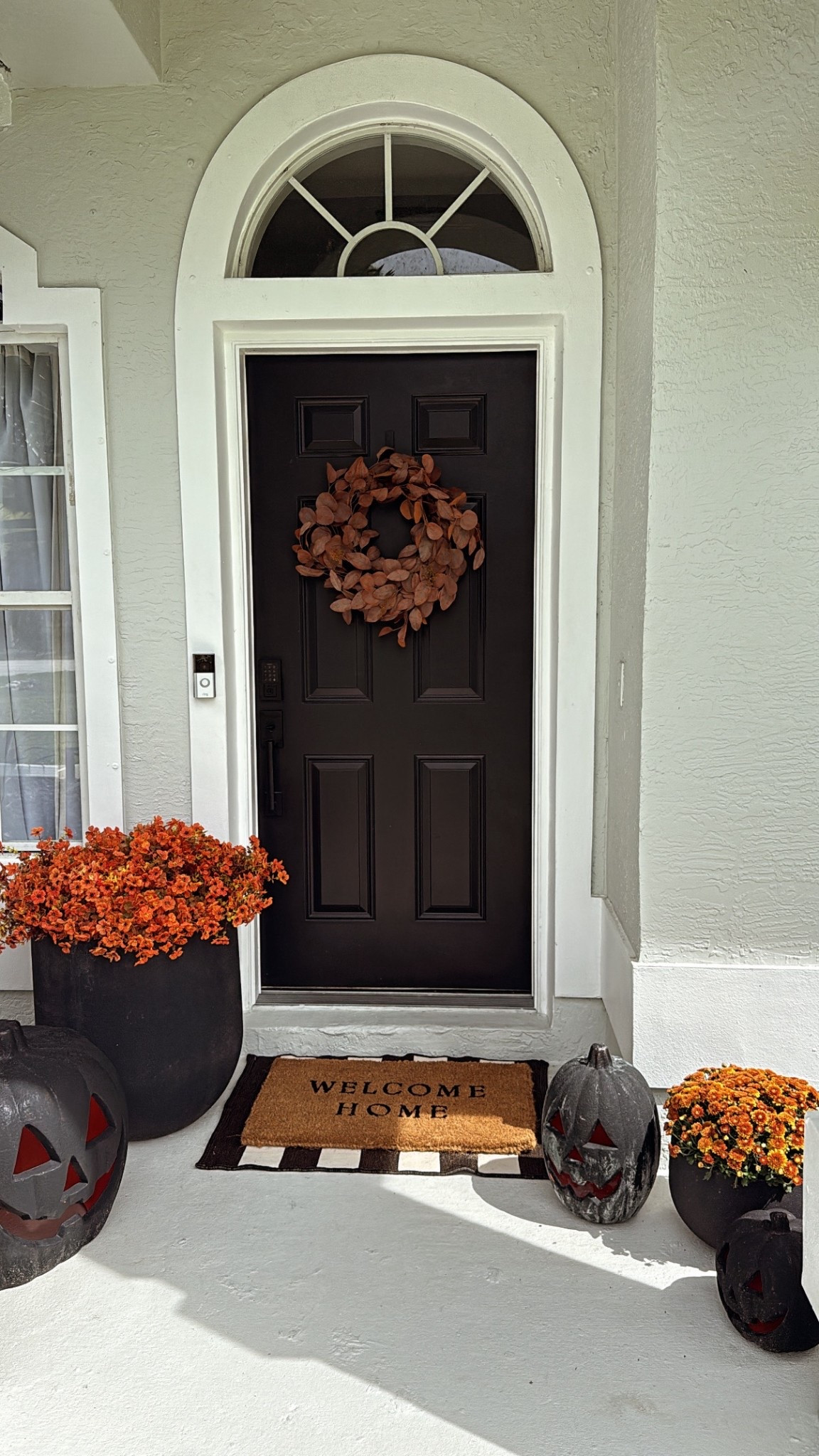 door wreath: target
orange leaves: amazon
welcome mats: target
pumpkins: home depot, painted with black paint