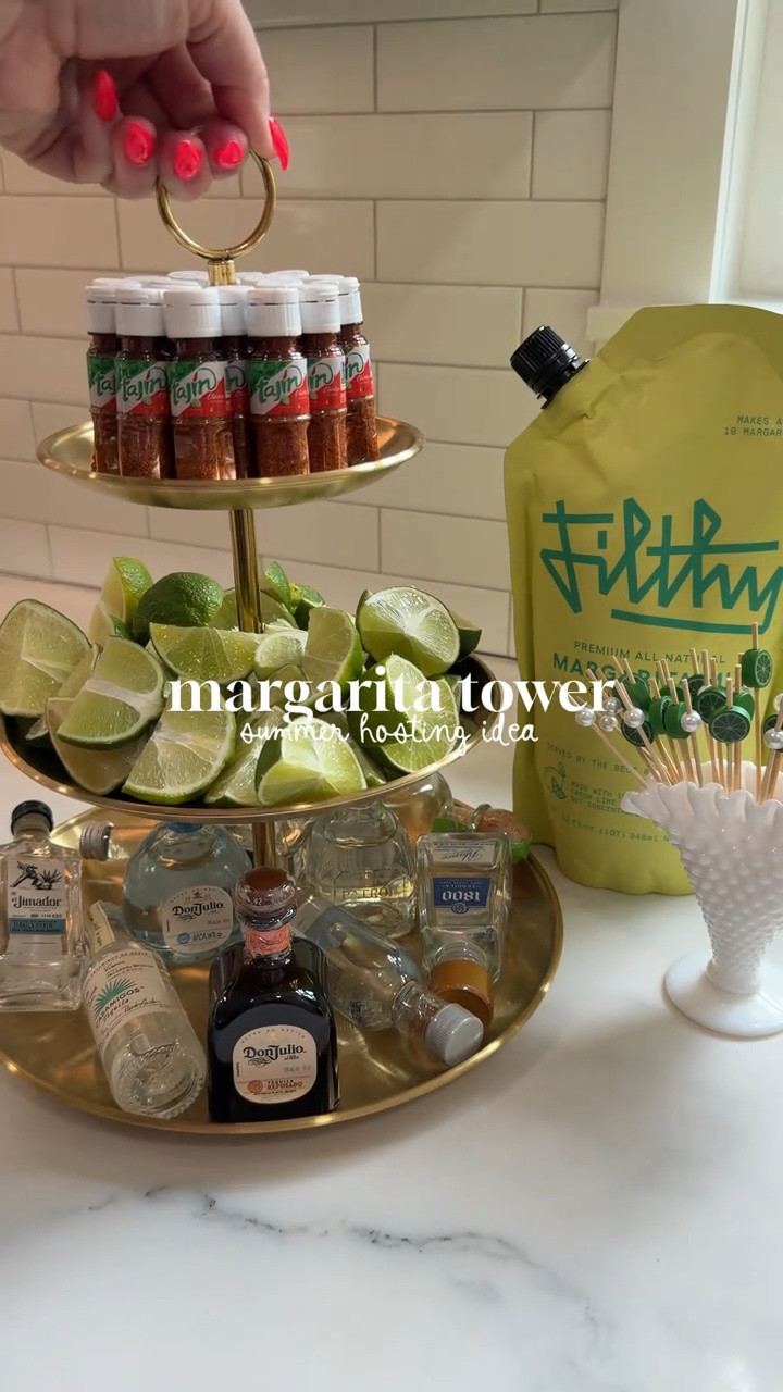 DIY margarita tower 🍋‍🟩✨ A summer hosting idea for the next time you grill out, have a party by the pool or invite the girl’s over! 

I love these mini tajin bottles - they’re always fun to have on hand!

#LTKfoodie #LTKSeasonal #LTKHome