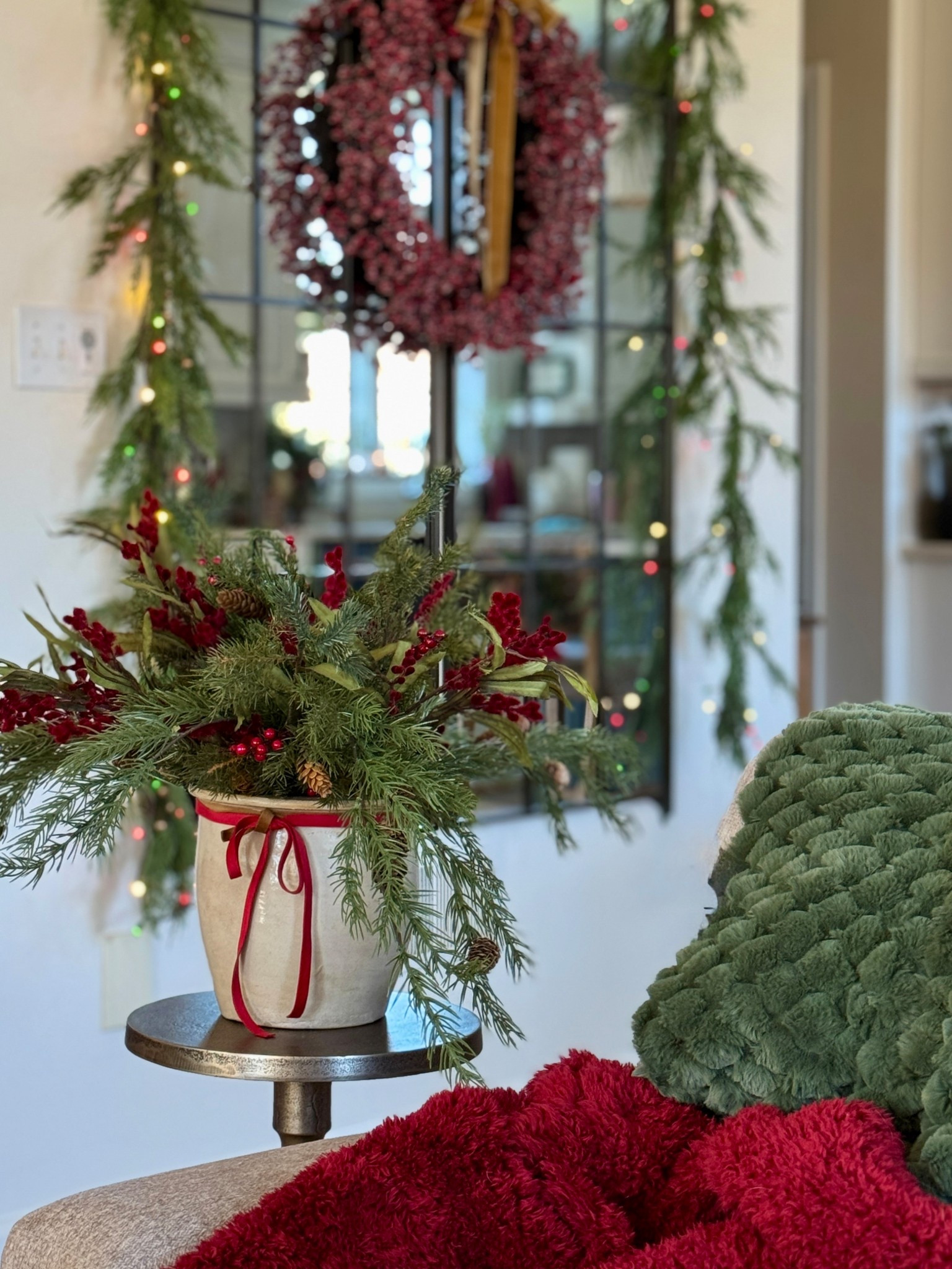 Black Friday sales: Tall 65x24 rectangular bronze wall mirrors (I have two side by side.) Pretty brushed gold accent pedestal table. Holiday flower arrangement. Red velvet ribbon and berry wreath. Real touch cedar garland. Cozy dark green throw. 

#LTKHome #LTKSaleAlert #LTKCyberWeek