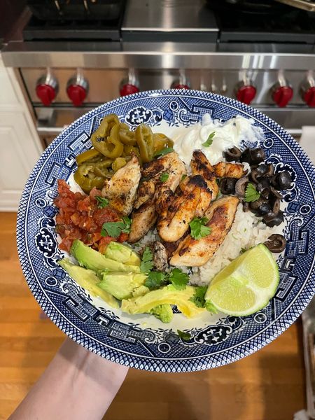 Blue willow dishes
Burrito bowl
I used Tyson short cuts grilled fajita chicken (near hot dogs)
Birds Eye frozen white rice & topped it with cilantro, lime zest & juice, sour cream, black olives, pickled jalapeños, avocado, salsa & a lime wedge 

#LTKHome #LTKFindsUnder100 #LTKOver40