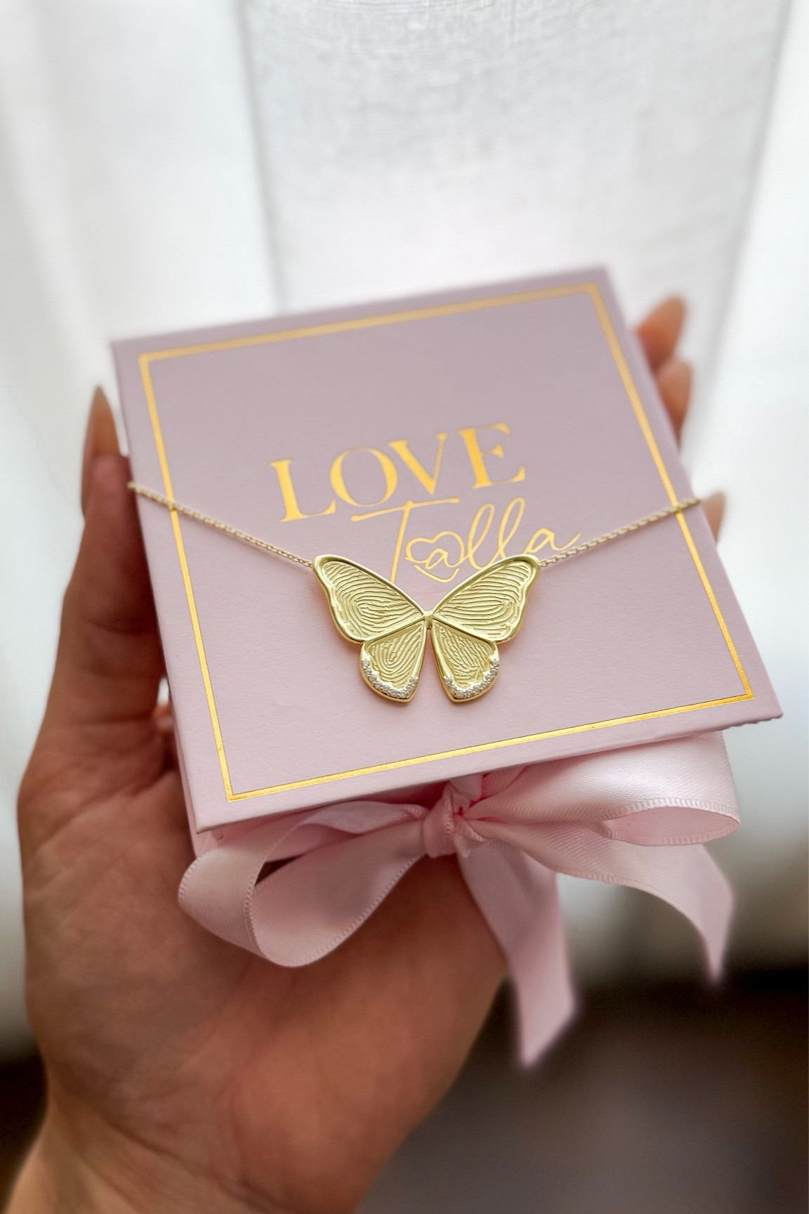 The most special jewelry I own 🥹 my four kids finger prints and signatures are on this butterfly!! 

#LTKMostLoved #LTKKids #LTKFamily