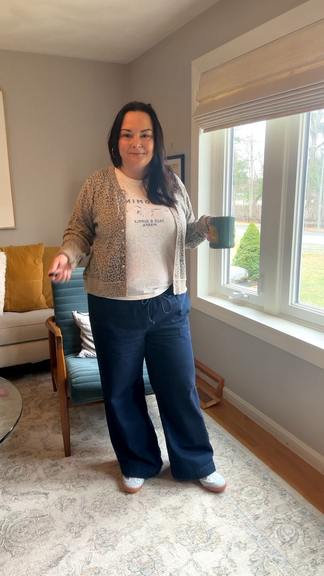 Casual midsize ootd with true to size wide leg pants, a graphic tee, and a lightweight cardigan. This comfortable outfit is easy, flattering, and perfect for real life. The relaxed fit pants are soft and breathable, paired with a simple graphic tee and a lightweight layer for a casual, put together look. A go-to everyday outfit formula for midsize women.

#LTKMidsize #LTKootd #LTKOver40