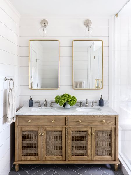 Our latest bathroom project featuring our favorite off-the-shelf wood vanity — the Pottery Barn Sausalito. We love this vanity for its natural variation and cane door fronts plus the marble top is exquisite. It comes in many sizes, and we used the 60” for this space. We swapped out the standard knobs for these brass beauties from Rejuvenation which takes the elegance up a notch. 

Shop the look and follow @pennyandpearldesign for more interior design & home style✨



#LTKfindsunder100 #LTKstyletip #LTKhome
