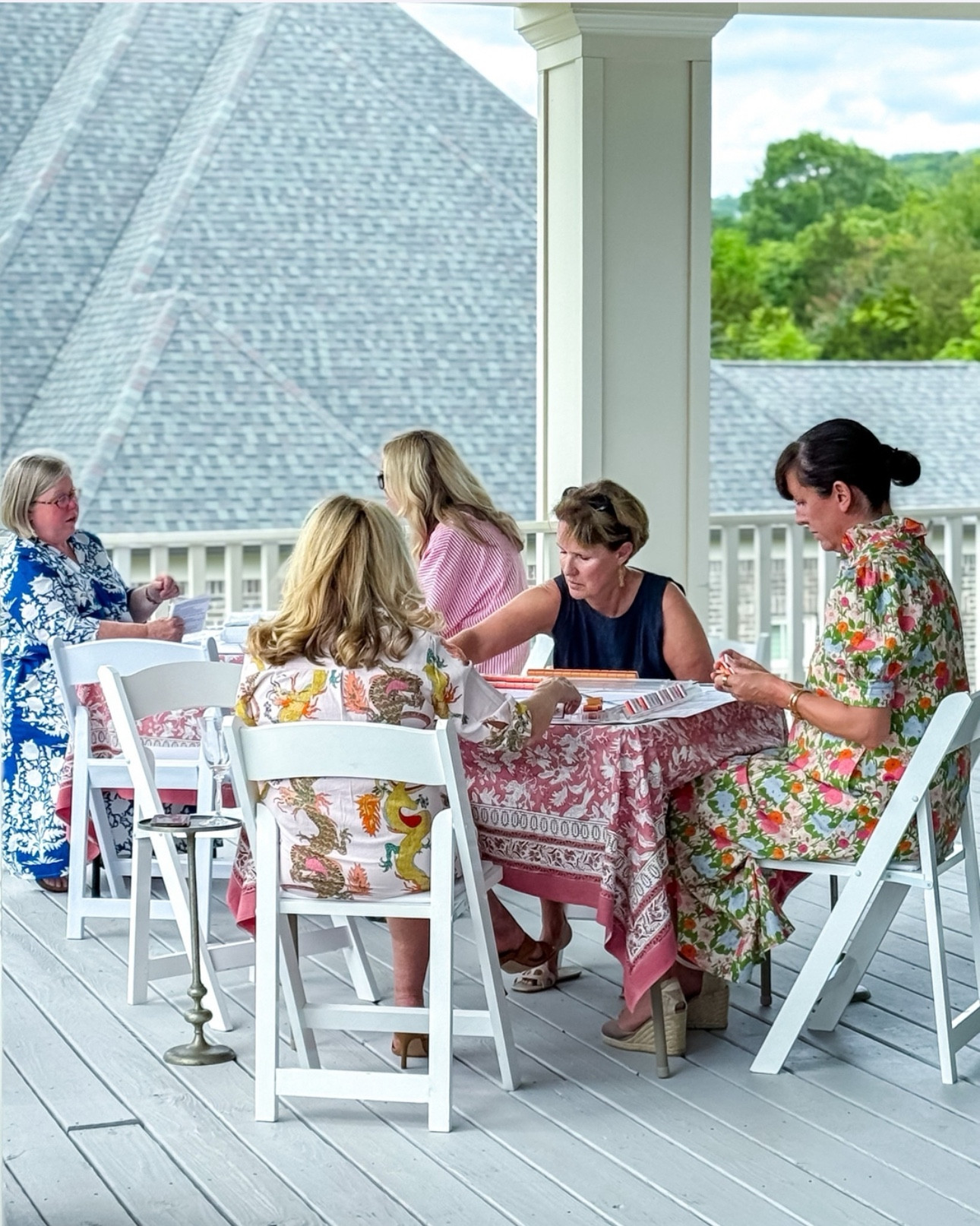 Nothing says summer like a warm breeze and an outdoor game of mahjong with friends. Jennifer’s covered porch with fans keeps it cool enough to enjoy being outside.

#LTKParties #LTKSummerEdit #LTKHome