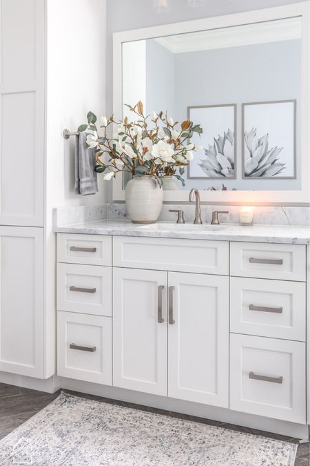 Magnolia flowers were the perfect compliment to my master bathroom! 🌸
•
•
•
#homebykmb #bathroomdesign #bathdesign #bathroomdecor #bathroomstyle #bathroomvanity #bathroominspiration #bathroominspo #bathroominterior #masterbath #bathroomsofinsta #bathroomofinsta #homedecoration #homedecorating #homedecorinspo #homedecorideas #homeinteriordesign #homestyling #homedecorblog #housedecoration #christmasdecor #christmasdecoration #christmasdecorating #christmashome #christmashomedecor #afloral 

#LTKhome #LTKSeasonal
