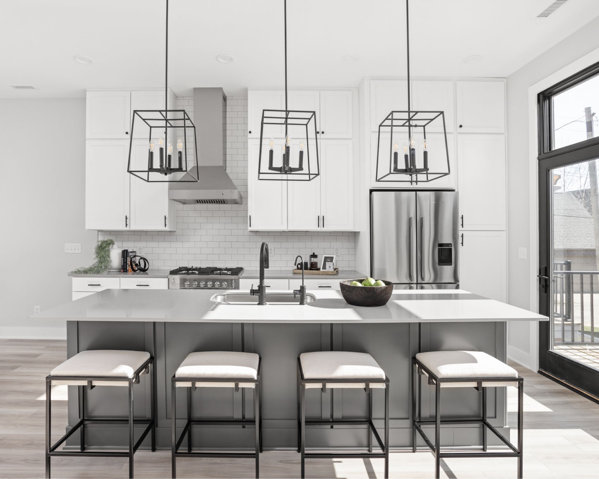 A gorgeous gray and white kitchen! We styled the space using blacks and creams. The stools complement the space perfectly. We love how it turned out!

Styled: Nested Spaces
Built: Estridge Homes
Photography: The Home Aesthetic 

#LTKstyletip #LTKhome #LTKfamily