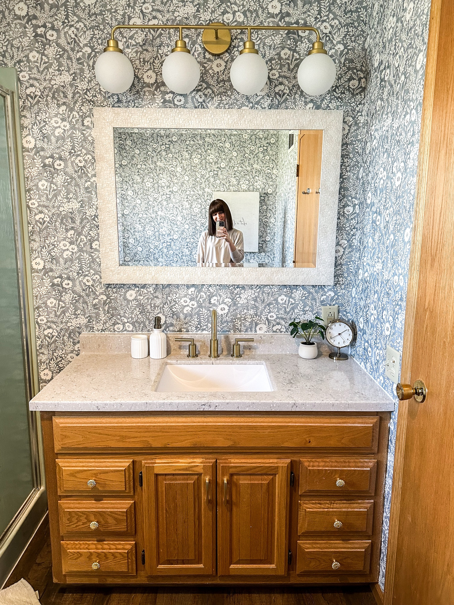 Spring break bathroom remodel. Mirror, vanity top and faucet are from Menard’s. Flooring is too. We kept the original vanity, tub and shower because they’re all usable and it saved $. I think sometimes my purpose in life is to leave each home a little better than we found it. 🥹

#LTKfindsunder50 #LTKfindsunder100 #LTKhome