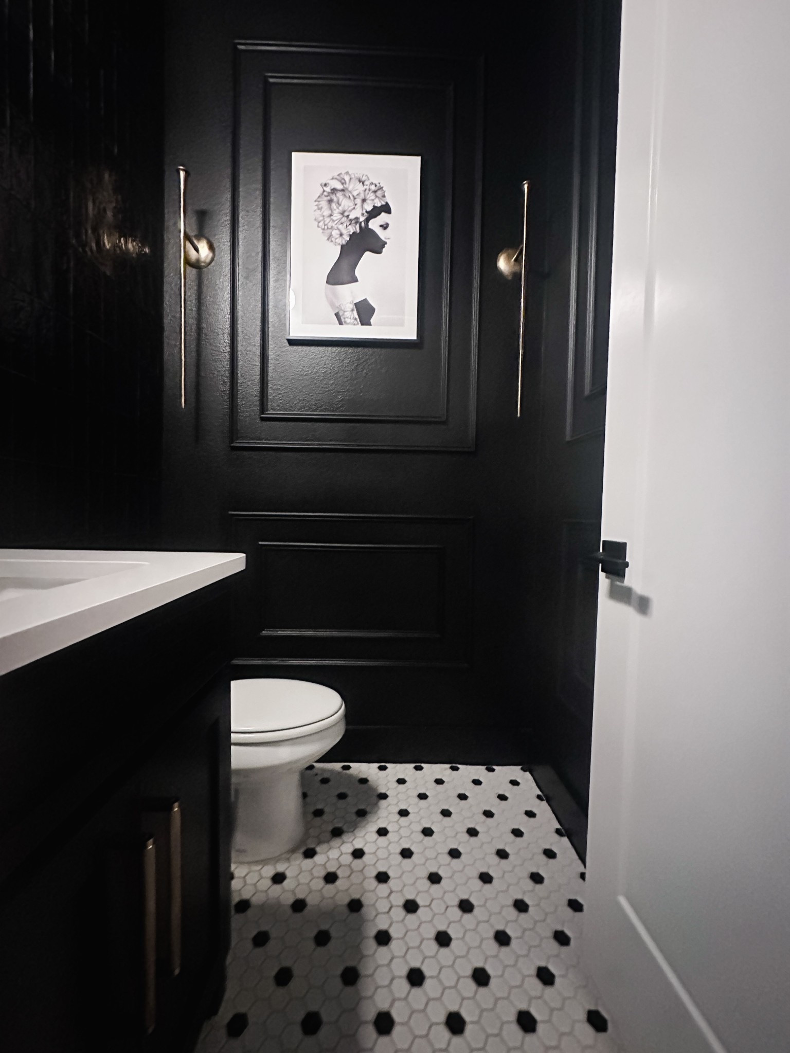 Black and white powder bath with brass accents 

#homedecor #moody #interiordesign #bathroomupgrade #bathroom #moodyinteriors

#LTKHome