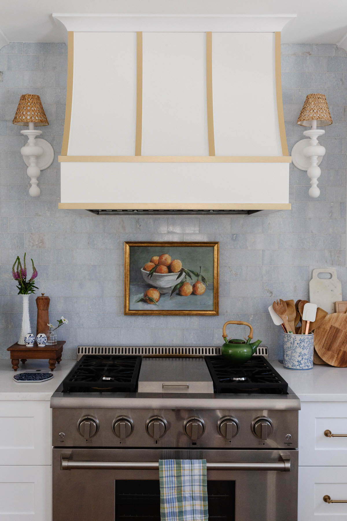 Our most-loved kitchen design ever—this Grandmillennial space layers classic charm with fresh updates: semi-handmade cabinets, a custom vent hood, rattan stools, and brass details. Timeless, not trendy. See below to shop the look and recreate the charm in your own home.

#ltkhome #ltkinterior #grandmillennialstyle #kitchendesign #traditionaltouches #blueandwhitekitchen #interiordetails #kitchenstyling #classicinteriors #peggyhaddadinteriors #semihandmadekitchen #kitchengoals #collectedhome #kitcheninspo
 

 #LTKHome #LTKFindsUnder50 #LTKFindsUnder100