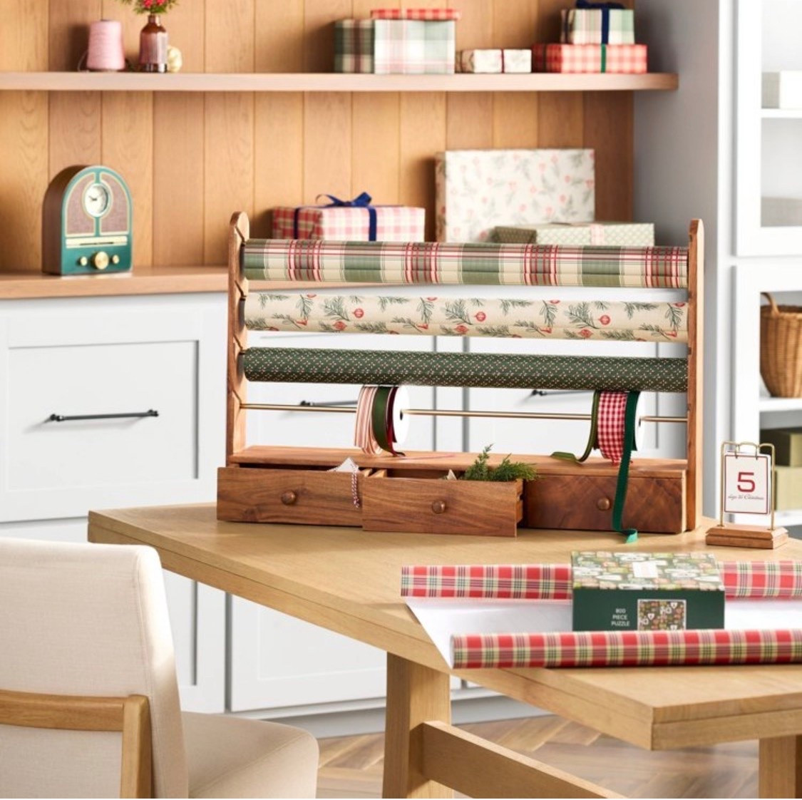 Efficiently wrap your holiday gifts with the help of this Gift Wrap and Ribbon Holder from Hearth & Hand™ with Magnolia. This holder features four removable rods to hold a variety of ribbon spools and gift wrap rolls for ease of use. Made of wood, it also comes with three drawers to store other gift wrapping supplies