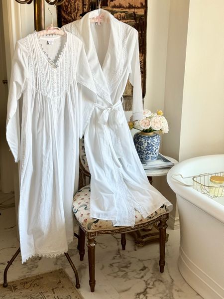 Timeless and classic pieces for every season,  @jacarandaliving is my go-to for beautiful, lightweight nightgowns and robes. Their website has the loveliest selection of fine embroidered linens and gifts. #ad
Of course I had to choose the Emily gown delicately embroidered with the palest blue flowers. I paired the gown with this long sleeve cotton robe featuring a delicate lace detail, a perfect style for anyone seeking a touch of elegance. 
When you purchase from Jacaranda Living, you are supporting the Zulu women in South Africa who hand embroider these pieces. I am certain you will find the loveliest gift for a special woman, young or seasoned, in your life. The baby collection is not to be missed! I hope this brand brings you as much joy, comfort, and a touch of luxury to your everyday life. 
#jacarandaliving 
#jacarandapartner
#elevengables
#grandmillennial
#victoriamagazine
#mycountryhome
#loveofcountryhouses 
#farmhouse
#victoriamagazine 
@victoriamagazine
@verandamag
@verandaviewpoint

#LTKHolidaySale #LTKGiftGuide #LTKHoliday