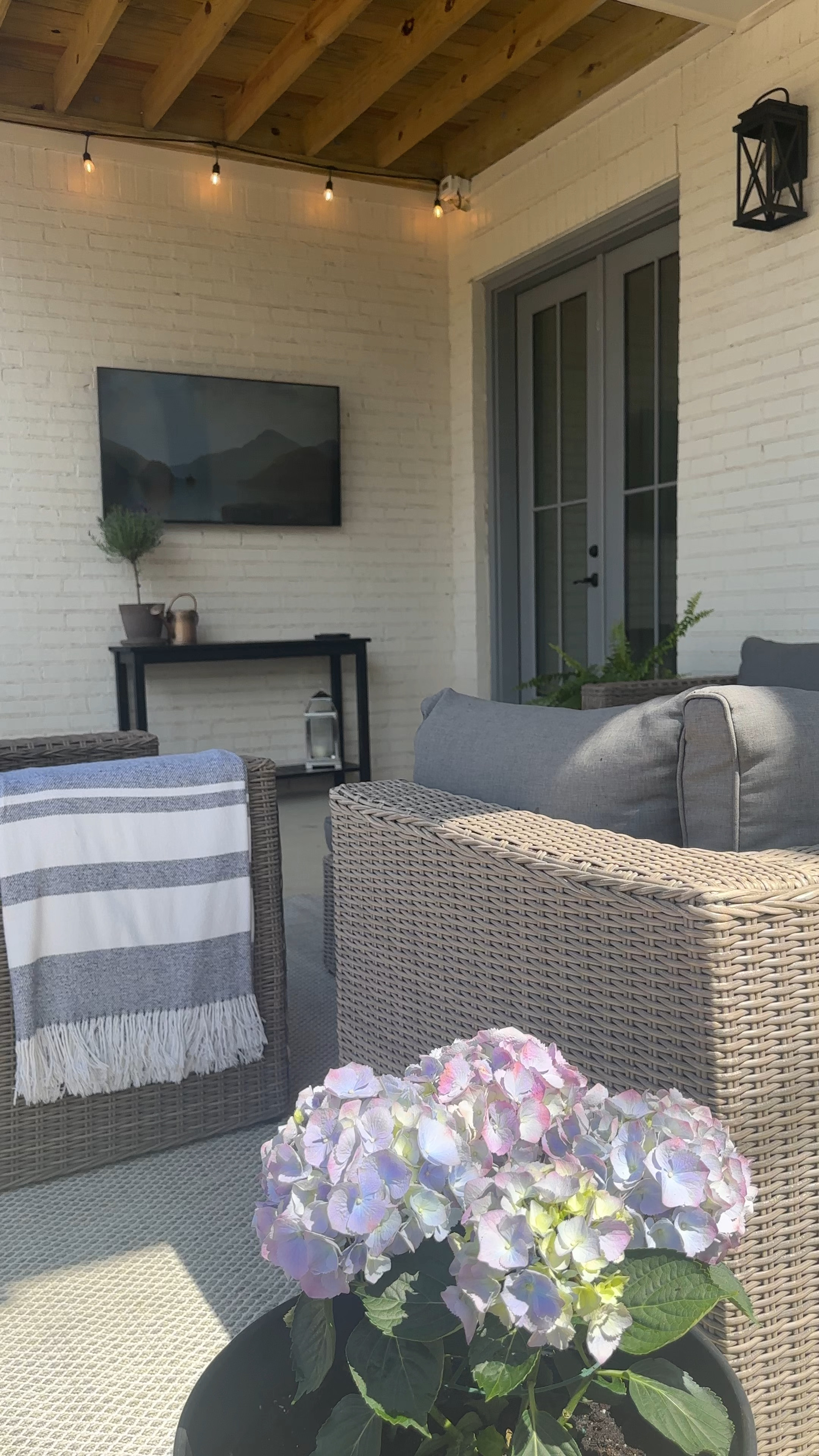 A spring porch refresh. Outdoor console table // new outdoor rug // patio on a budget

#LTKhome #LTKfindsunder100