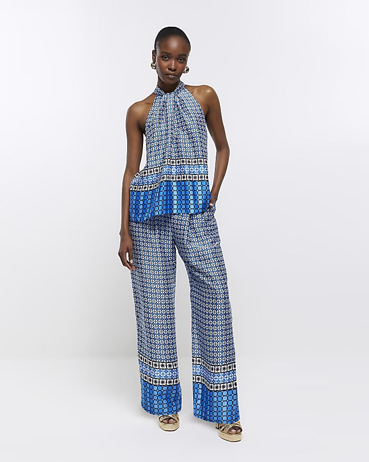 Blue geometric print wide leg trousers | River Island (UK & IE)