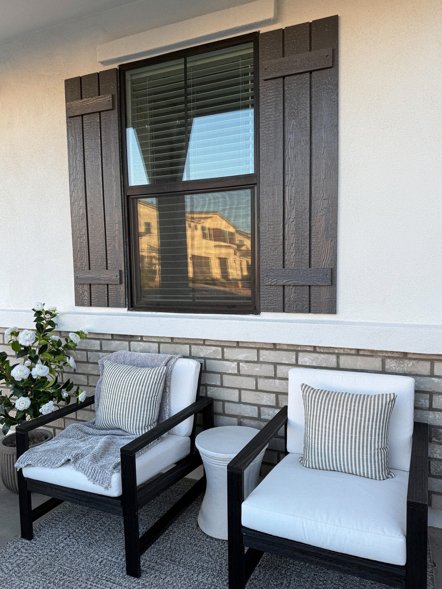 small front porch decor || outdoor lounge chairs, outdoor rug, white patio table, striped outdoor table, throw blanket, concrete fluted outdoor planter (size medium), faux outdoor tree, spanish moss

#LTKHome