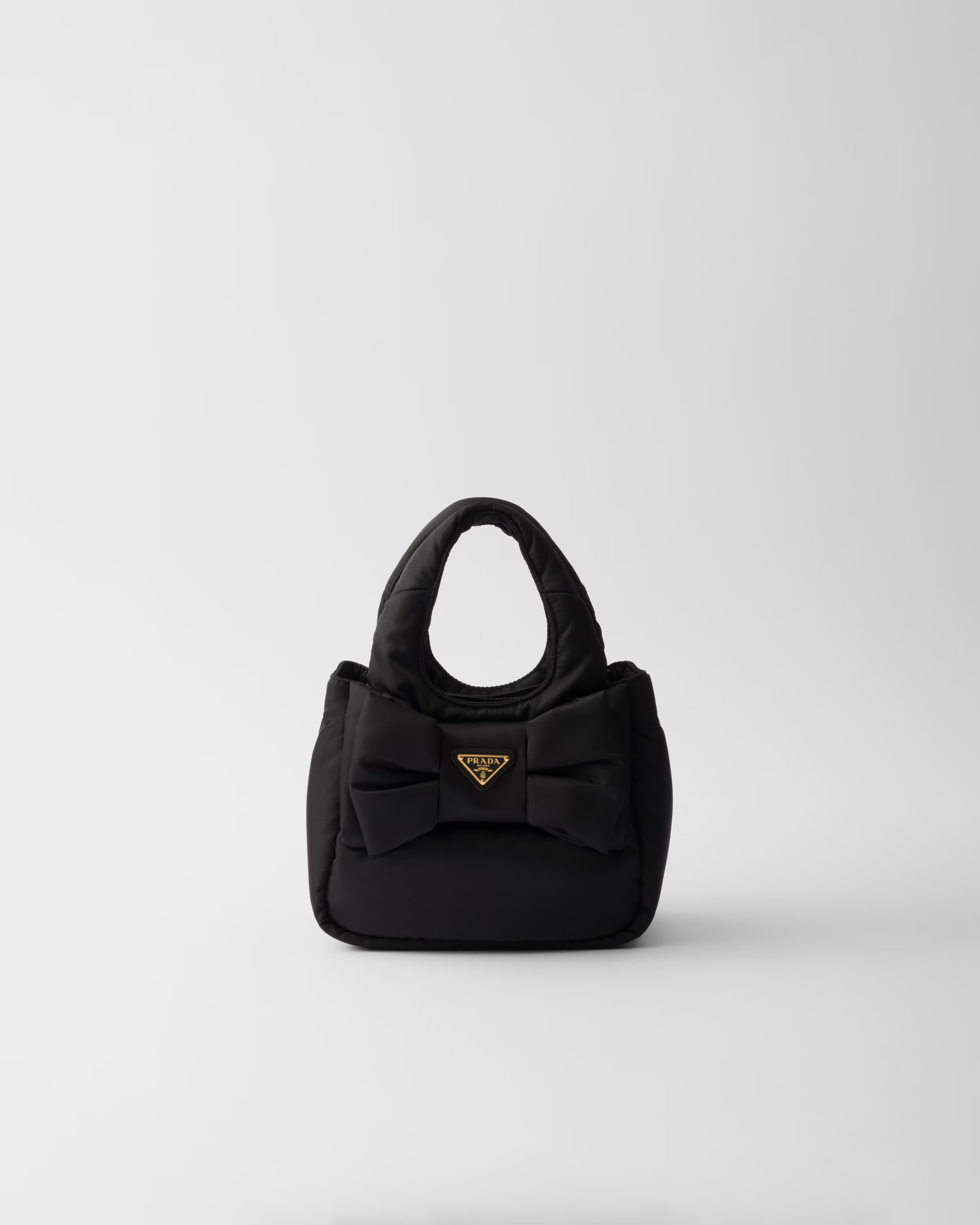 Mini padded Re-Nylon bag with bow | Prada US