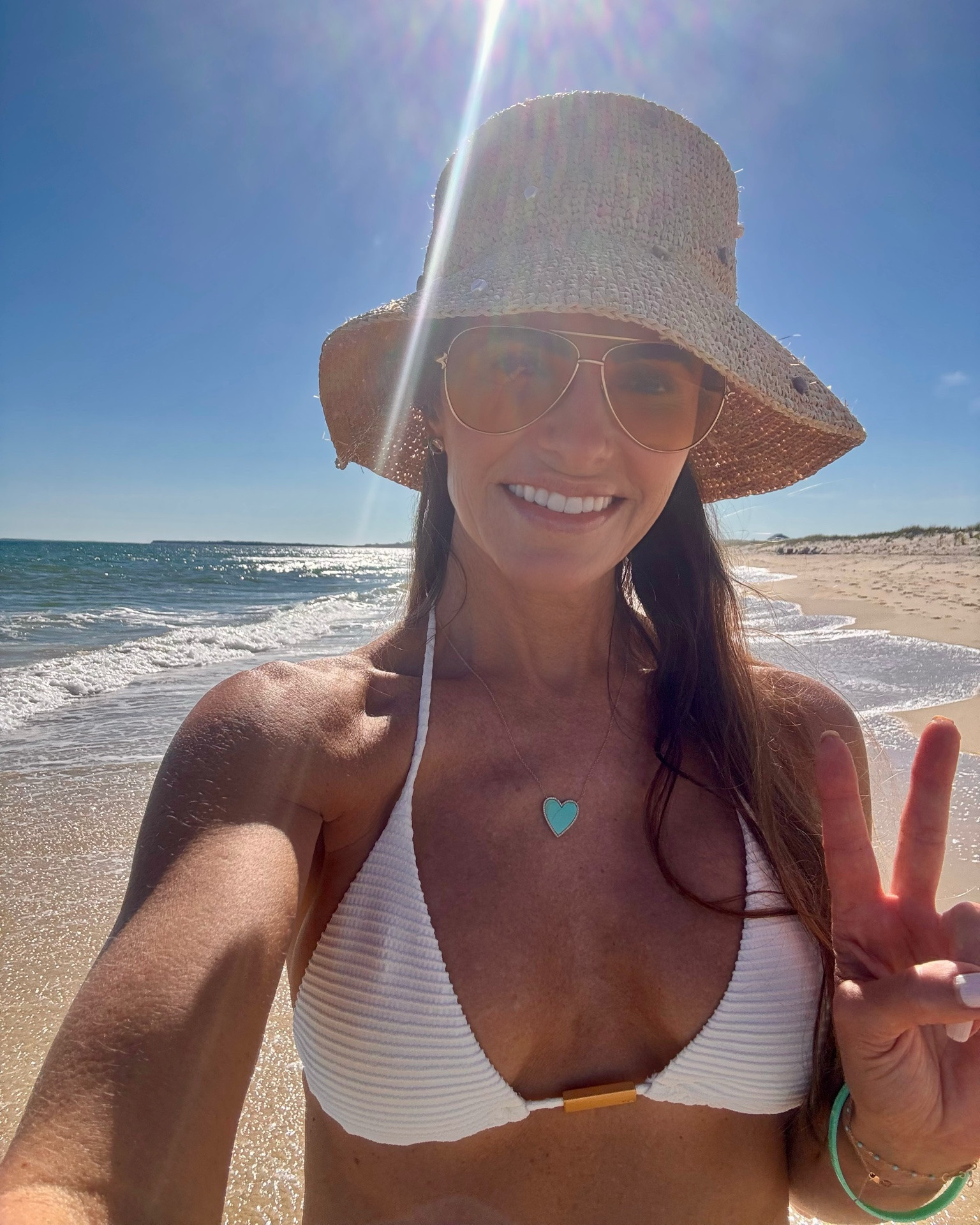 we’re enjoying our vitamin d, sunshine & beachtime walks in martha’s vineyard too🐚 

shop my fav swim hat, beach essentials + cover-ups, swimwear, sunscreen & accessories too! 

suit top runs pretty tts wearing small but if > 34B go up size & bottoms run small i size up to medium

skirt runs tts wearing small

#LTKTravel #LTKSwim #LTKfitnessgoals