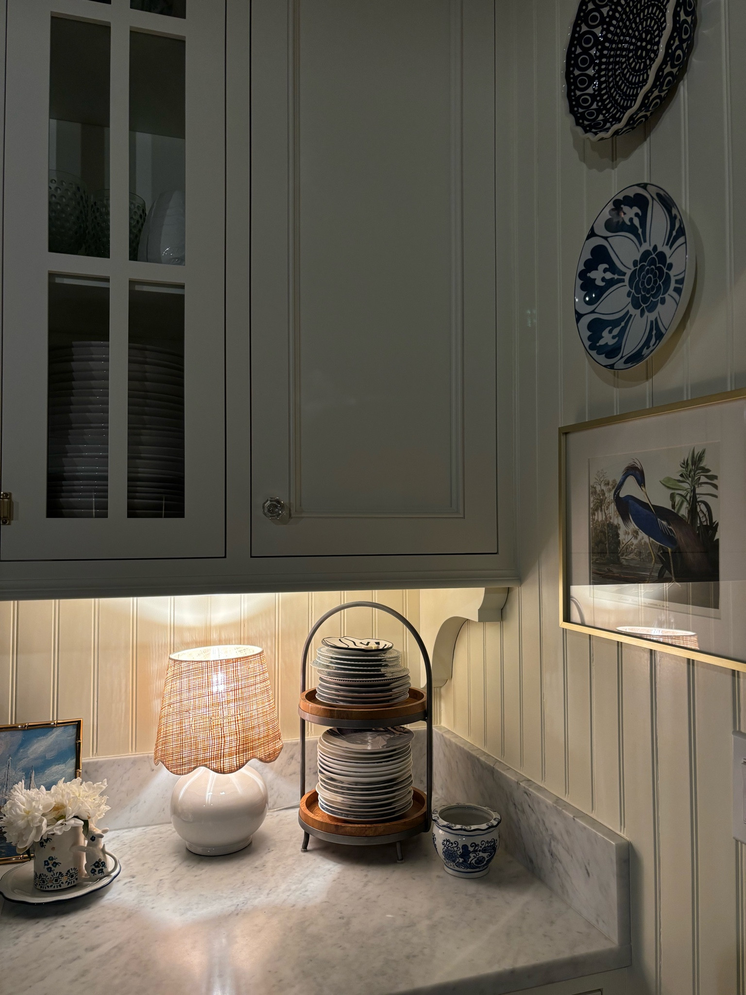 Mini lamp with woven scalloped shade, wood and metal tiered stand, heron art and gold frame, blue and white bowl  on wall, hardware 

#LTKStyleTip #LTKSaleAlert #LTKHome