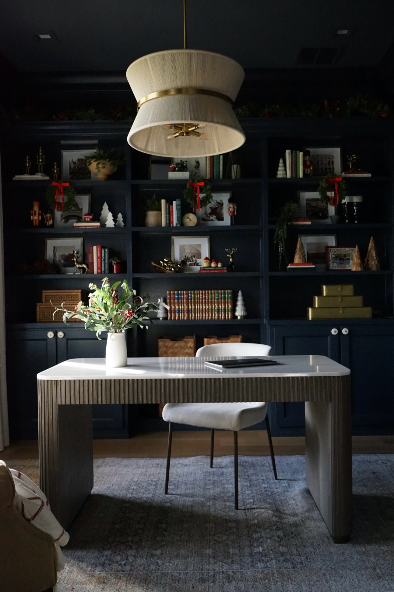 Christmas decor for the bookshelf. Linked everything that was link able! 

Moody office, home desk, office rug, transitional home, office light 

#LTKHoliday #LTKSeasonal #LTKHome