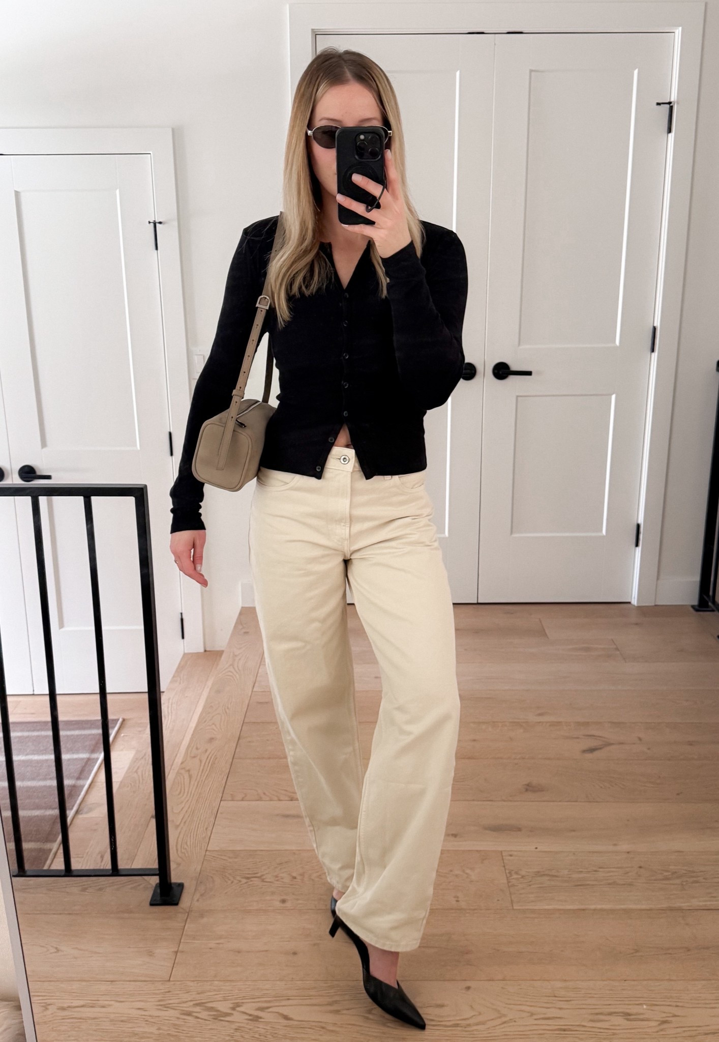 Neutral outfit for early spring with loose fit ecru jeans, stretchy ribbed cardigan, black heels, and perfect suede bag. #LTKitbag #LTKfinds 

#LTKSeasonal #LTKootd