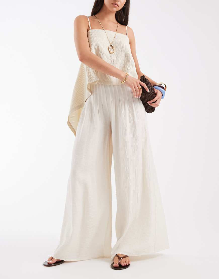 ASOS DESIGN Tailored palazzo sheer pleated pants in cream-White | ASOS (Global)