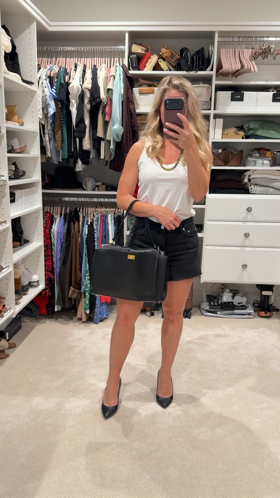 A little bit polished, a little bit undone — my favorite combination.

I love taking casual staples like a white tank and black denim shorts and elevating them with sharp accessories. The heels and structured bag make this feel instantly more intentional without trying too hard.

An easy reminder that basics don’t have to feel basic.

#LTKootd #LTKPetite #LTKSeasonal