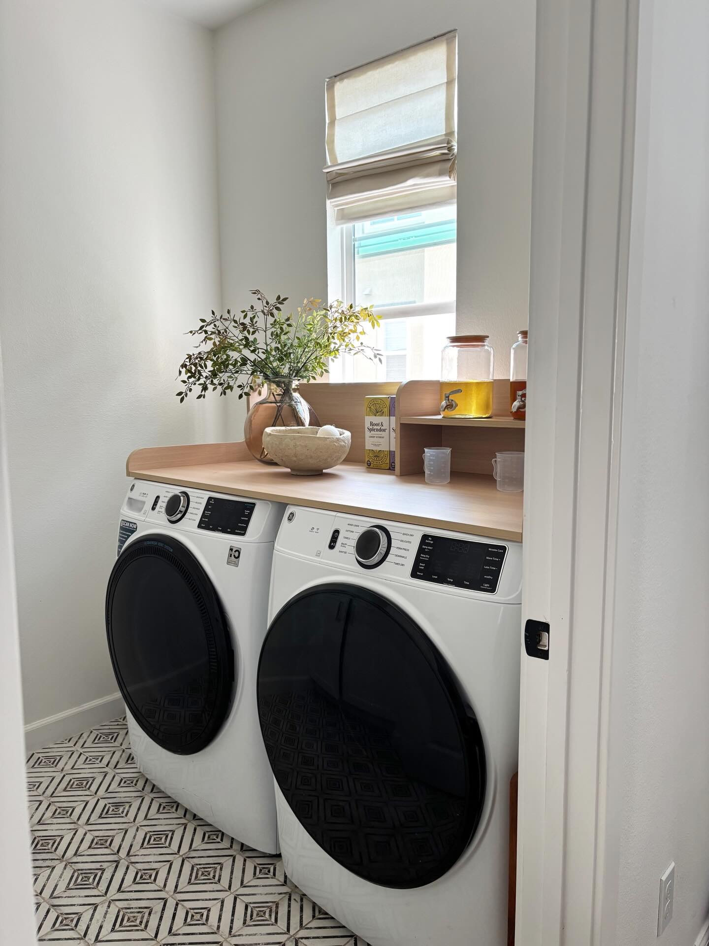 a few looks of our new two-tiered washer/dryer countertop 🤍

Other details:
- liquid detergent is @rootandsplendor (our favorite nontoxic detergent)
- paper mache bowl is a FBMP find 
- glass amber vase is from @homegoods 
- the countertop doesn’t shake when our washer/dryer is on
- our front load washers came with our home when we purchased it & of course we weren’t gonna turn them down (for everyone who says they’re trash 🙂)

🤍 save this if your laundry room needs this too
🤍 follow @neutralsbydanee for more real-life home finds + home inspo 

🏷️ laundry room setup, laundry room ideas, functional laundry room, small laundry room, laundry room organization, renter friendly homes, renter friendly home ideas, small laundry room setup

#LTKSaleAlert #LTKHome #LTKmomlife