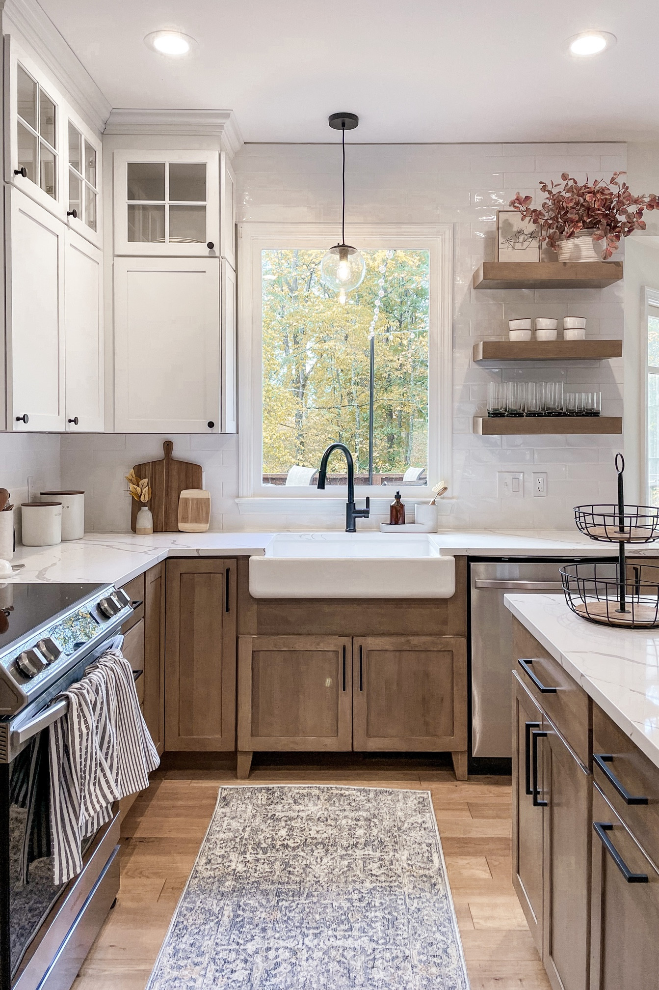 Wood and white kitchen links! Cabinets are Husk stain on Maple wood by Kraftmaid. 

(Farmhouse sink, faucet, oven, light fixture, etc.)

#LTKhome