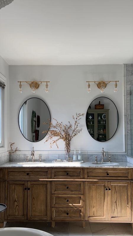 A master bathroom transformation of my dreams. Marble, polished nickel, warm wood and accents of brass makes the most beautiful combination. Sprinkle in some vintage finds and you have my dream bathroom  

#LTKVideo #LTKhome