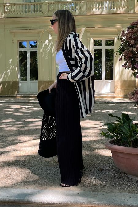 Mixing and matching co-ords in the Spanish heat. This is the best tip I can give for holiday outfits… pack a couple of co-ords, and they will give you so many outfit options, especially when you combine them with other tops layered underneath. 🤍🖤
Stripe set | Black and white stripe trousers | Black and white stripe shirt | Shirt and trousers set | Pyjama set | Holiday wear | Poolside coverup | Loose leg trousers 

#LTKeurope #LTKstyletip #LTKitbag