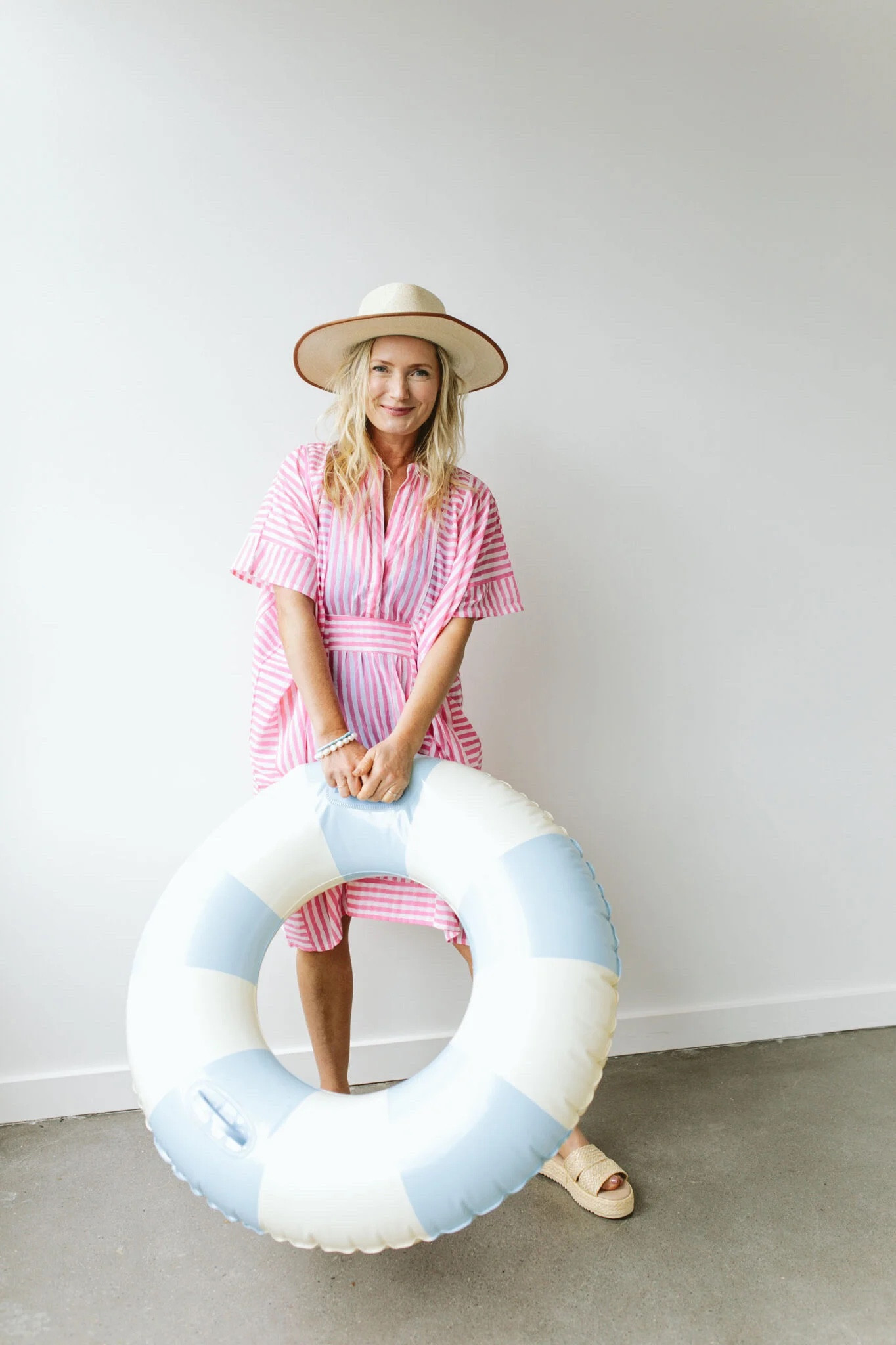 This is the most lightweight, easy breezy cotton (but nice quality) caftan out there. I used to own the same one in blue but longer and loved it. The alternating stripes create a pattern that moves your eye around and thus distracts from what is underneath. You don’t have to tie it either if you want it to be loose (the tie is on the inside). It also comes in other colors (the darker colors aren’t see-through and you can wear it as a dress), but my goodness it’s PERFECT. I feel so cute, comfortable, and not too exposed to belly up to a restaurant at the beach or hotel.

#LTKSeasonal #LTKtravel #LTKstyletip