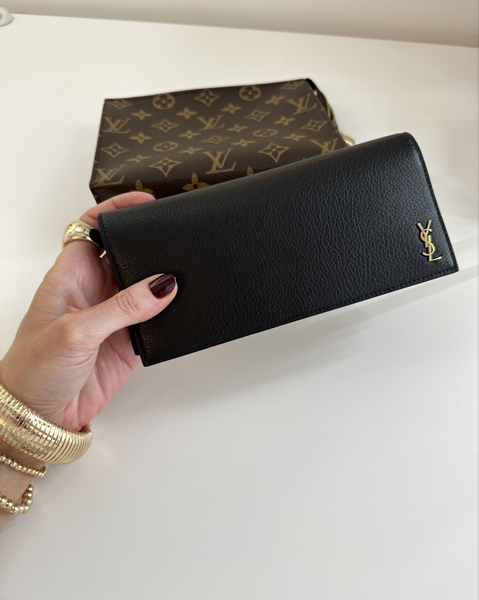 I’ve had this black Saint Laurent Tiny Cassandre Flat Wallet for over a year & carry it exclusively.✨

It’s my favorite wallet…ever! I love that the bills slide easily into the filer section & there is no exterior zipper or extra added weight. Very large coin compartment with a smooth & rich zipper 😮‍💨

#LTKTravel #LTKStyleTip #LTKItBag