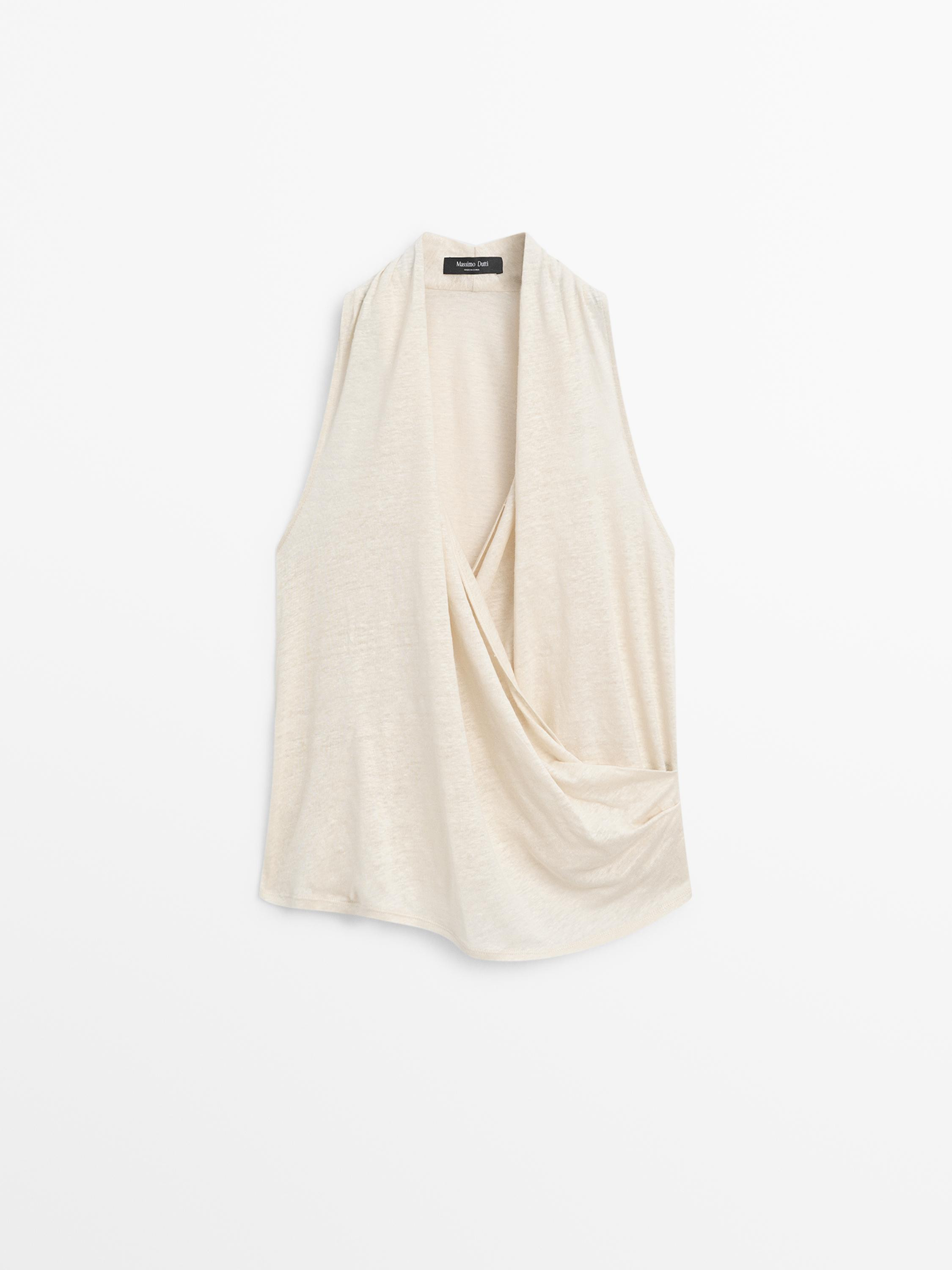 VIEW LOOK
Surplice top with draped detail

 $70  Colour  Beige  Add to basket | Massimo Dutti US