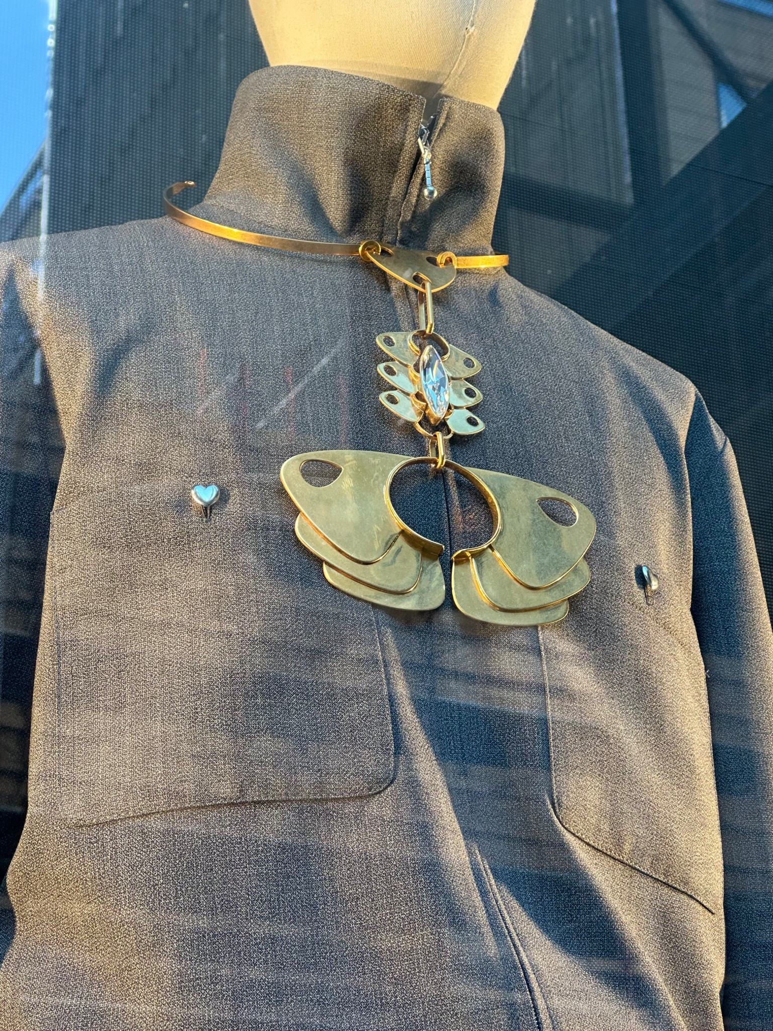 Just passed this necklace at Valentino. I found a similar Valentino here. 