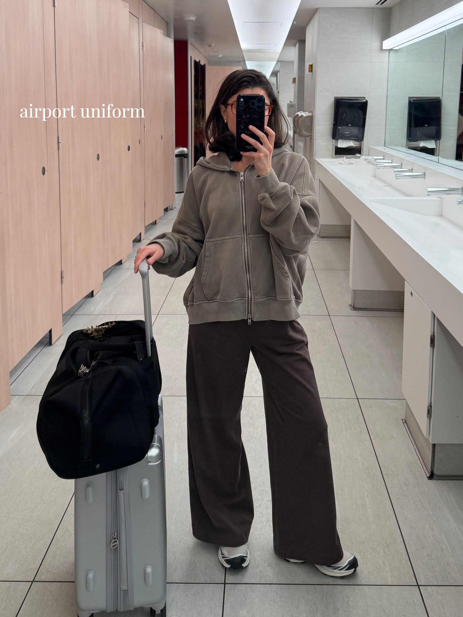 [3/5/26] airport uniform always ✈️ hoodie is men’s from @abercrombie AF and currently on sale! Pants are so comfortable from @gap and paired with a matching brown ribbed tank. The band is flexible which is so nice for long trips! I did xs in pants and small in tank, but could’ve sized down to xs. Sneakers are so comfy, I sized down .5! Suitcase is from @CALPAK and duffle is @Dagne Dover 

#LTKPetite #LTKSaleAlert #LTKTravel