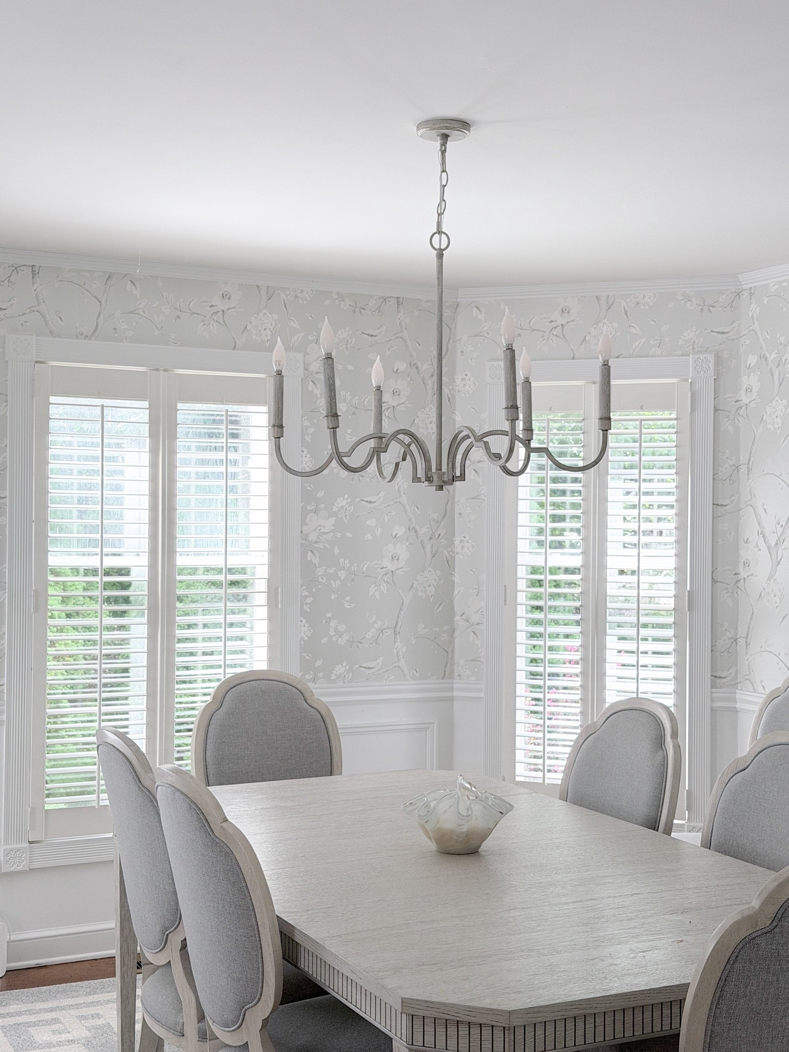 Light & airy traditional& neutral formal dining room with a mid sized chandelier & metallic chinoiserie floral wallpaper

#LTKHome