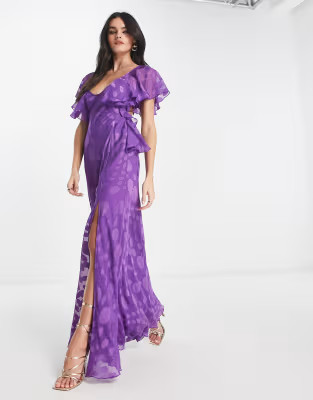 ASOS DESIGN satin spot flutter sleeve maxi dress with open back in purple | ASOS (Global)