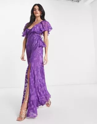 ASOS DESIGN satin spot flutter sleeve maxi dress with open back in purple | ASOS (Global)