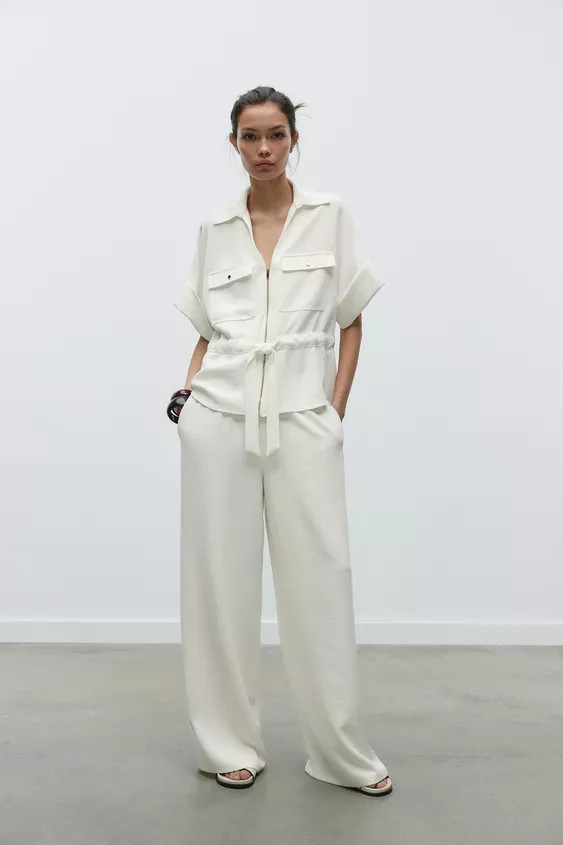 Lapel collar shirt with V-neck and long sleeves with buttoned tab cuffs. Front flap patch pockets... | Zara US