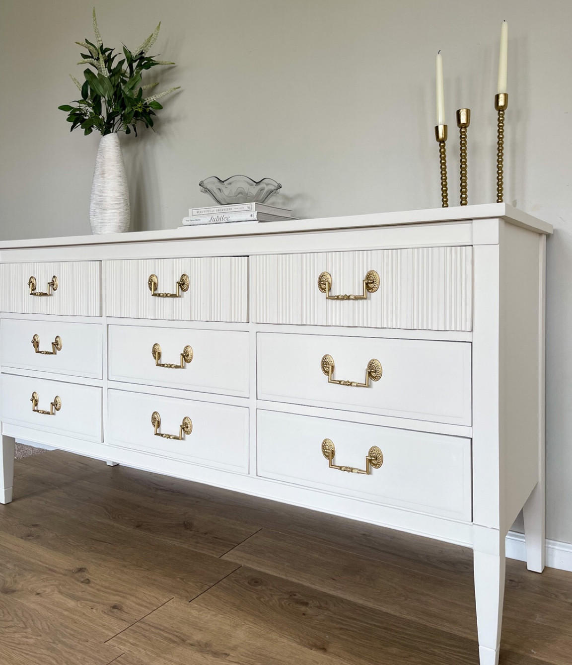 Dresser makeover with fluted design. Painted in a white mineral paint, with a fun peel and stick wallpaper design. Here are most of the products used. 