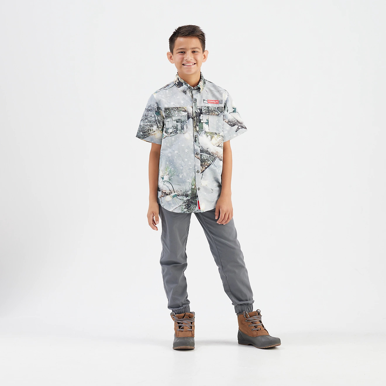Magellan Outdoors Boys' Laguna Madre Holiday Mossy Oak Break-Up Country Snowdrift 2.0 Fishing Shi... | Academy Sports + Outdoors